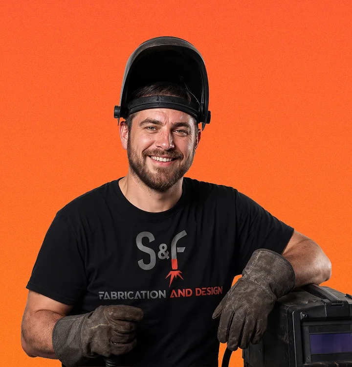 S&F Fabrication and Design team member in welding gear