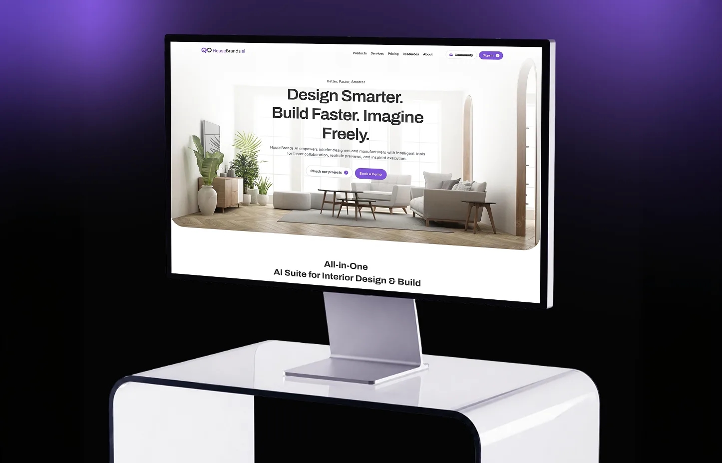 HouseBrands AI website shown on a monitor stand