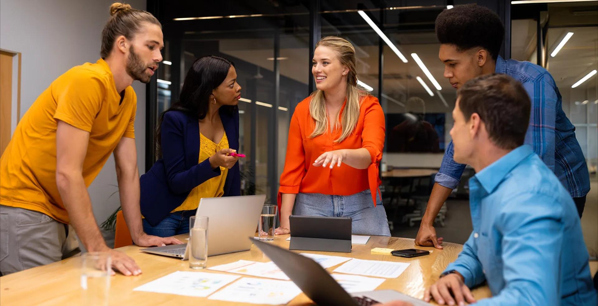 Project team discussing designs in a meeting