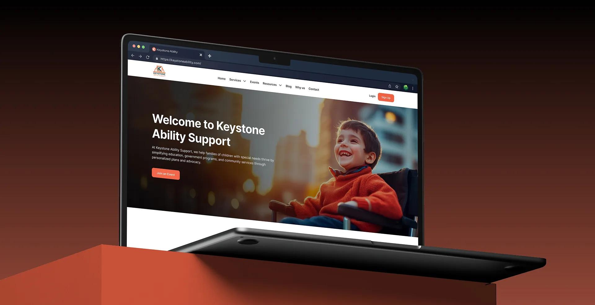 Keystone Ability Support website shown on a laptop
